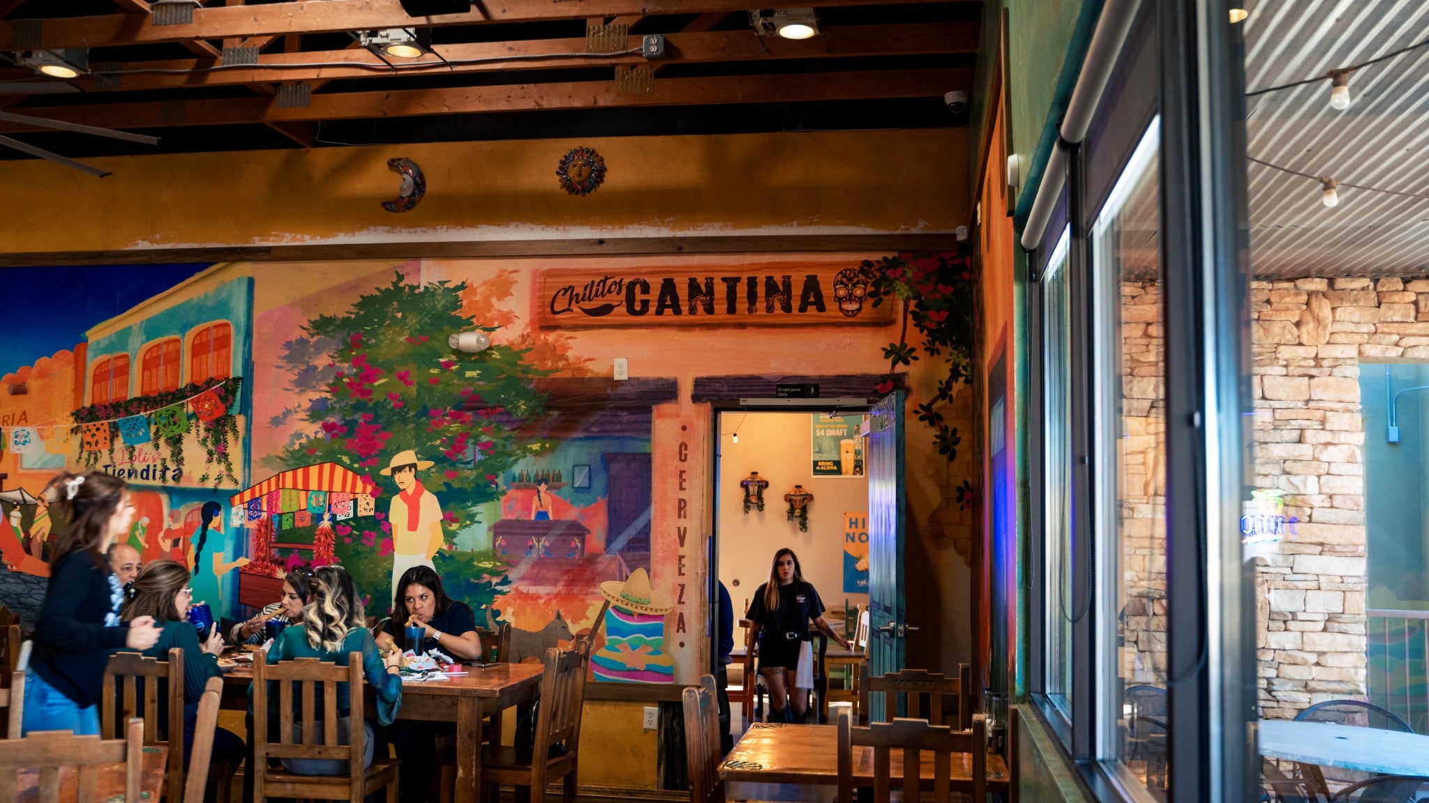 Colorful painted cantina mural inside Chilitos Foothills