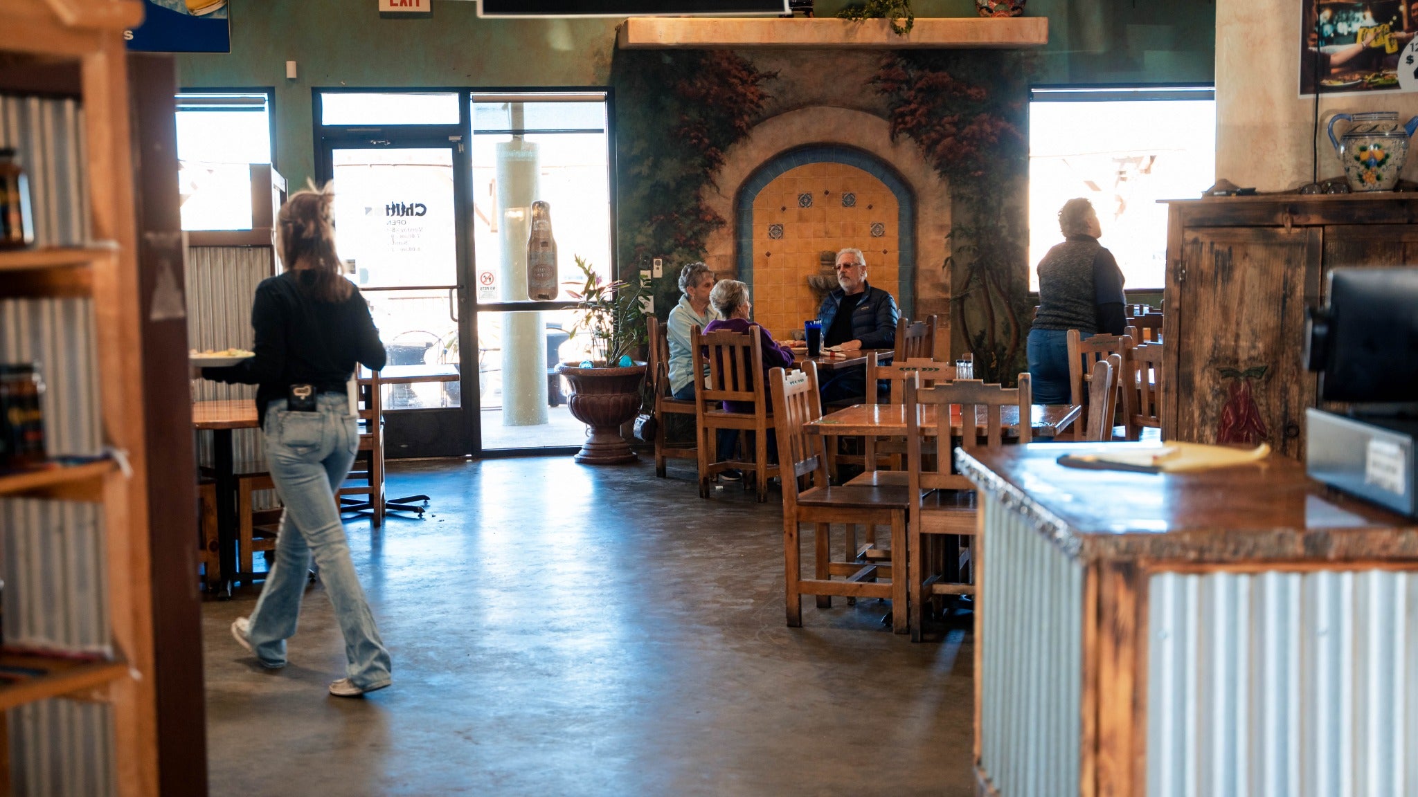 Brick arch and rustic dining room inside Chilitos